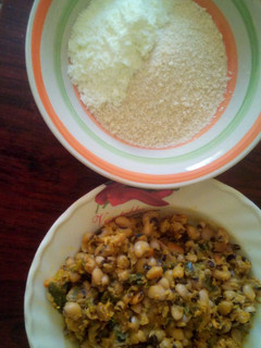 A picture of Beans porridge and spring onion plus garri, milk and sugar.