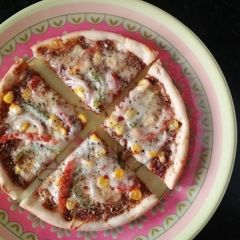 A picture of Crispy corn cheesy pizza (in kadhai).
