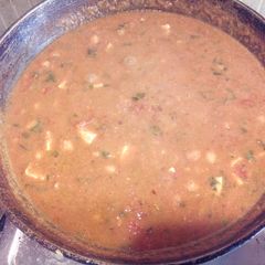 A picture of Chole paner tomato curry.