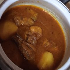 A picture of Three spice chicken Aloo salan.