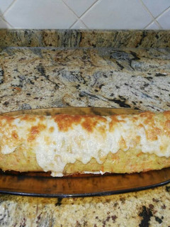 Una foto de Rollo de patata relleno de jamón york y queso
