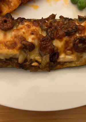 A picture of Mushroom and goats cheese stuffed zucchini.