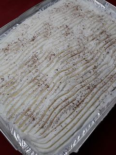 A picture of Ravani with Whipped Cream.