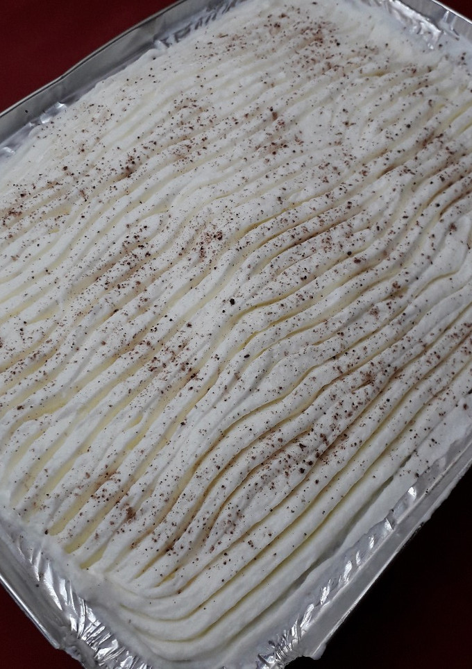 A picture of Ravani with Whipped Cream.