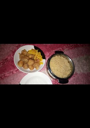 A picture of Macaroni,fried chips and yam balls.