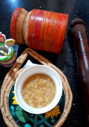 A picture of Mil's Fresh,quick Ginger garlic with mortar pestle.