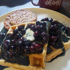 A picture of Cinnamon Chaffles with Buttermilk Blueberry Syrup.