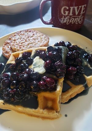 A picture of Cinnamon Chaffles with Buttermilk Blueberry Syrup.