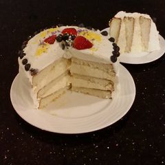 A picture of Vanilla Layer Cake with Lemon Cream Filling and Lemon Whipped Cream Frosting.