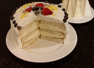A picture of Vanilla Layer Cake with Lemon Cream Filling and Lemon Whipped Cream Frosting.