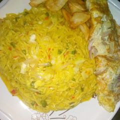 Vegetables indomie with fried egg and chip's A picture of Vegetables indomie with fried egg and chip's.