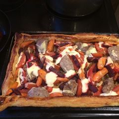 A picture of Veggie Puff Tart with a bit sausage.