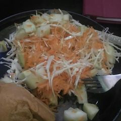 A picture of Moimoi and cole slaw (cabbage, cucumber and carrot).