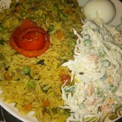 A picture of Curry fried rice with coslow.