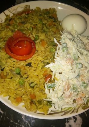 A picture of Curry fried rice with coslow.