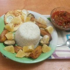 A picture of Rice with stew and plantain.