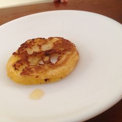 A picture of Apple cinnamon pancake rings with apple syrup.