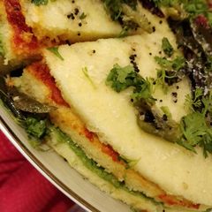 A picture of 3 type of dhokla but layered utapam.