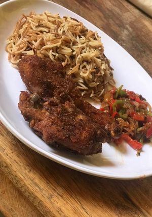 A picture of Lebanese rice and southern fried chicken.