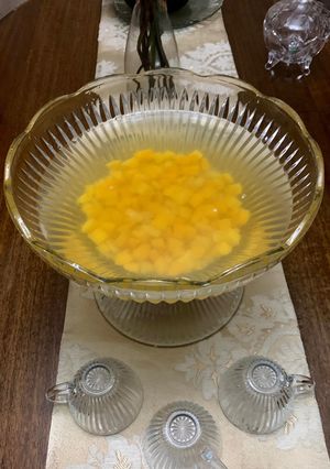 Una foto de Ponche de durazno y piña
