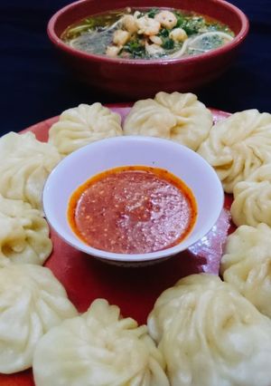 A picture of Chiken_MomosAnd #Chilli_Sauce With#Spicy_Shrimp_Pho.