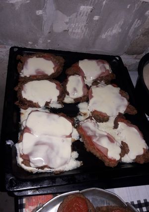 Una foto de Milanesa napolitana