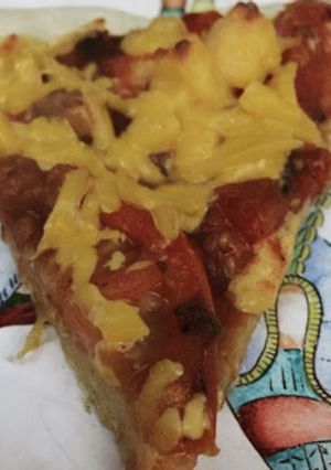 Una foto de Pizza de tomates asados y cheddar