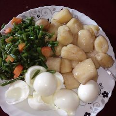 A picture of Marine with boiled eggs and greens.