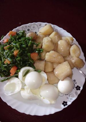 A picture of Marine with boiled eggs and greens.