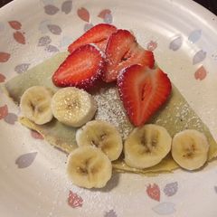 A picture of Basic Crepe with strawberry banana Nutella spread.