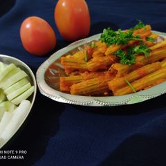 A picture of Drumstick tomato curry.