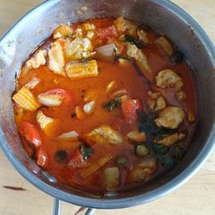A picture of Red curry with Chicken and vegetables.