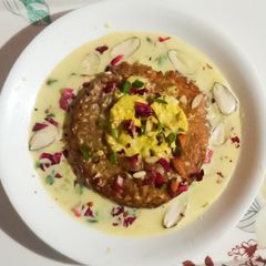 A picture of Paneer Malpua with kesar Rabri.