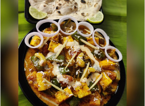 A picture of Dhaba Style Kadhai Paneer With Tandoori Roti.