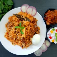 A picture of Mutton biryani in electric rice cooker.