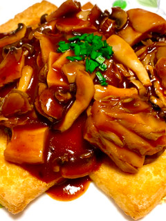 A picture of Tofu Grill with Red Wine & Mushroom Sauce.