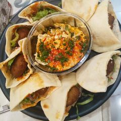 A picture of Falafel with hummus.