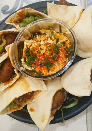 A picture of Falafel with hummus.