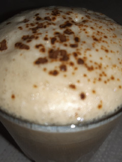A picture of Instant coffee with lots of foam.