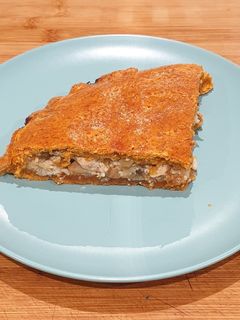 Una foto de Empanada de pollo y champiñones
