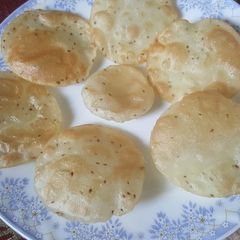 A picture of CHAUSELA chawal ke atte ki puri.