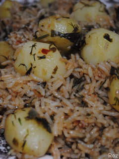 A picture of Herbed rice with potatoes.