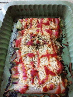 Una foto de Rollitos de puerro con jamón y queso al horno