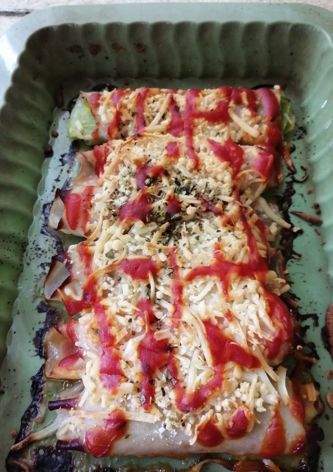 Una foto de Rollitos de puerro con jamón y queso al horno