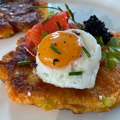 A picture of St Brigid’s Boxty with Wild Salmon and Goddess Dressing.