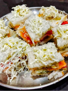 A picture of Tomato Cucumber Cheesy Sandwich.