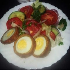 A picture of Scotch Eggs and Salad.