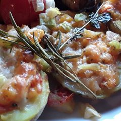 A picture of Sig's Tomato and potato mash filled potato boats.