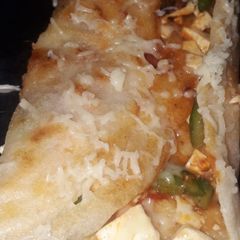 A picture of Mixed dal paneer schezwan cheese dosa.