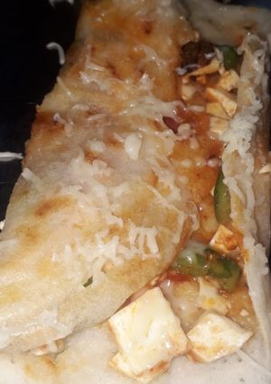 A picture of Mixed dal paneer schezwan cheese dosa.